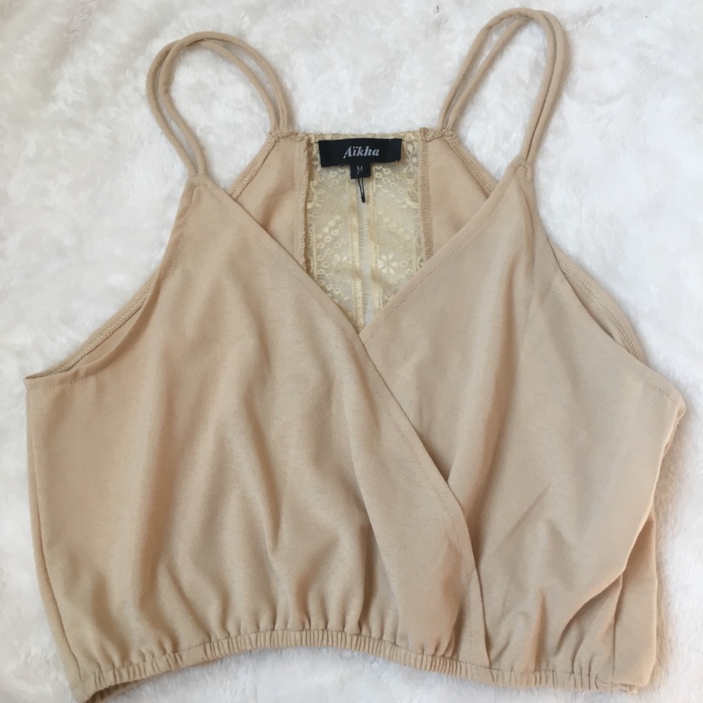 nude colored crop top, laced back, crossed front